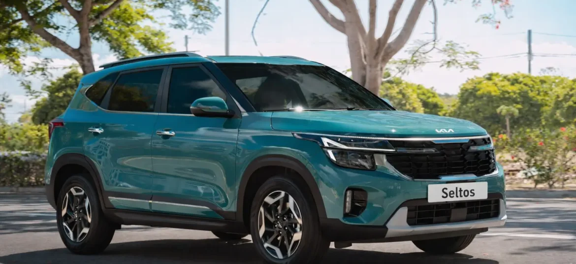 A turquoise blue color Kia seltos suv parked in parking lot few trees